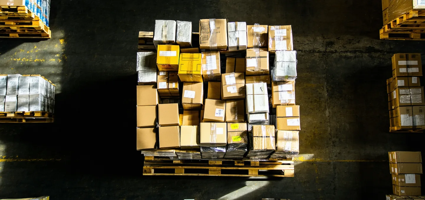 Overhead view of a mixed-SKU pallet with many different types of products stacked irregularly